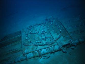 Quadruple torpedo tube mount on seabed - roller bearings visible